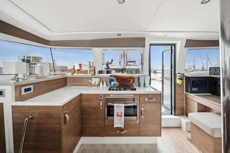 Slide: The Image of Modern kitchen interior of 2023 Bali 4.2 yacht with wood accents and ocean view. - 52