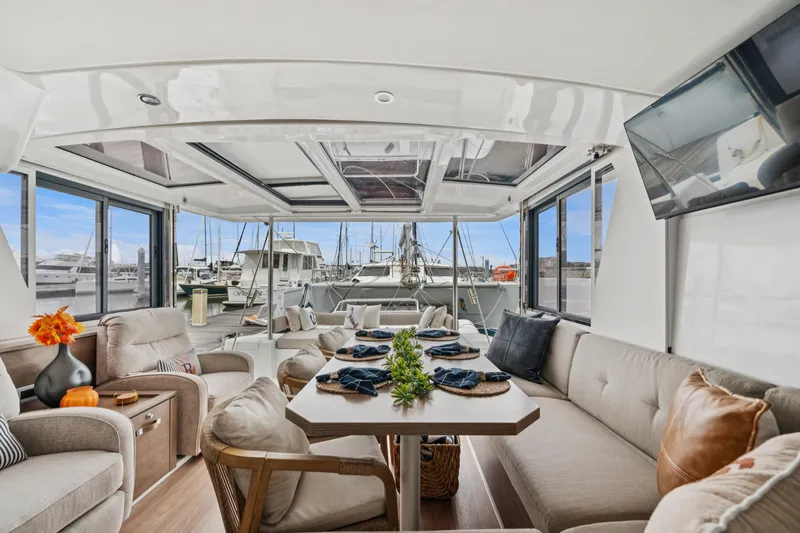 Slide: The Image of Luxurious interior of 2023 Bali 4.2 yacht with elegant seating and marina view. - 56