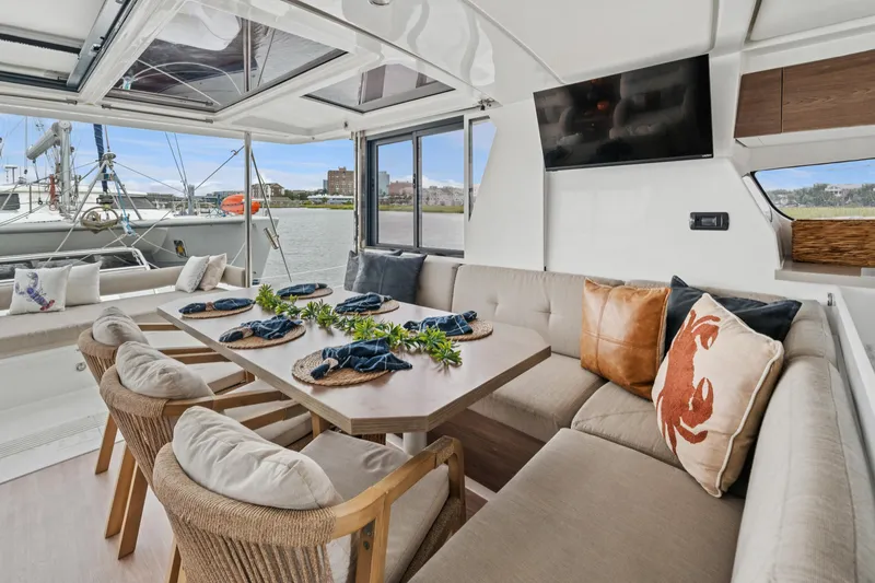 Slide: The Image of Luxurious interior of 2023 Bali 4.2 yacht with elegant dining area and waterfront view. - 57