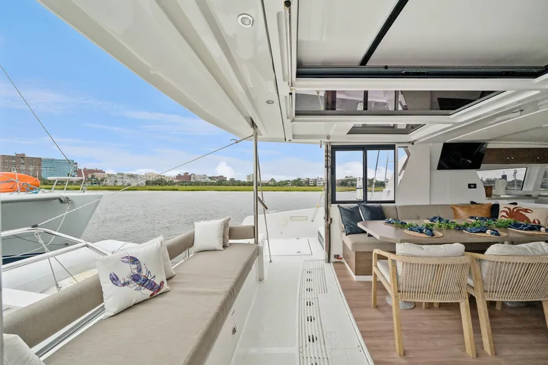 Slide: The Image of Luxurious 2023 Bali 4.2 yacht interior with spacious seating and scenic waterfront view. - 61