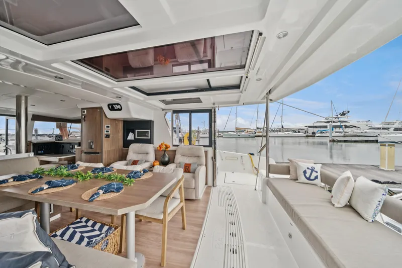 Slide: The Image of Luxurious 2023 Bali 4.2 yacht interior with elegant dining area and marina view. - 62
