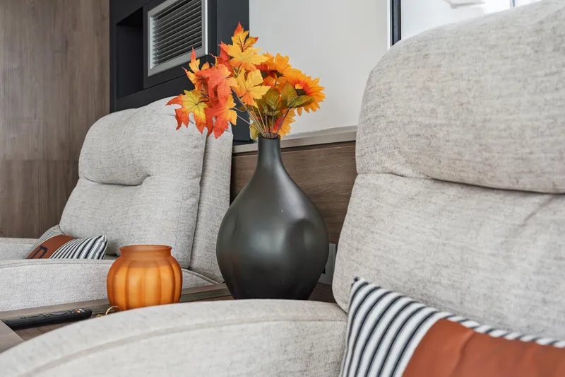 Slide: The Image of Cozy living room with beige chairs, autumn flowers, and decorative vase, Bali 4.2, 2023. - 65