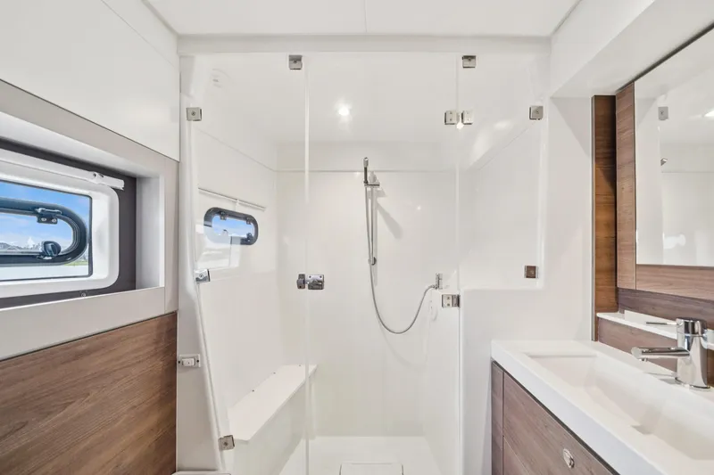 Slide: The Image of Modern bathroom in 2023 Bali 4.2 yacht with sleek shower and wooden accents. - 73