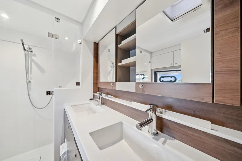 Slide: The Image of Modern bathroom interior on 2023 Bali 4.2 yacht, featuring dual sinks and sleek shower design. - 75