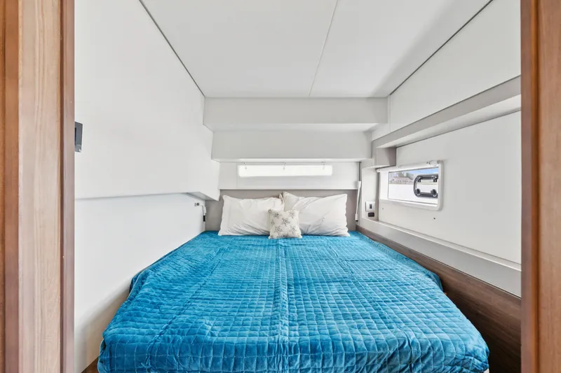 Slide: The Image of Luxurious cabin interior of 2023 Bali 4.2 yacht with blue bedding. - 76