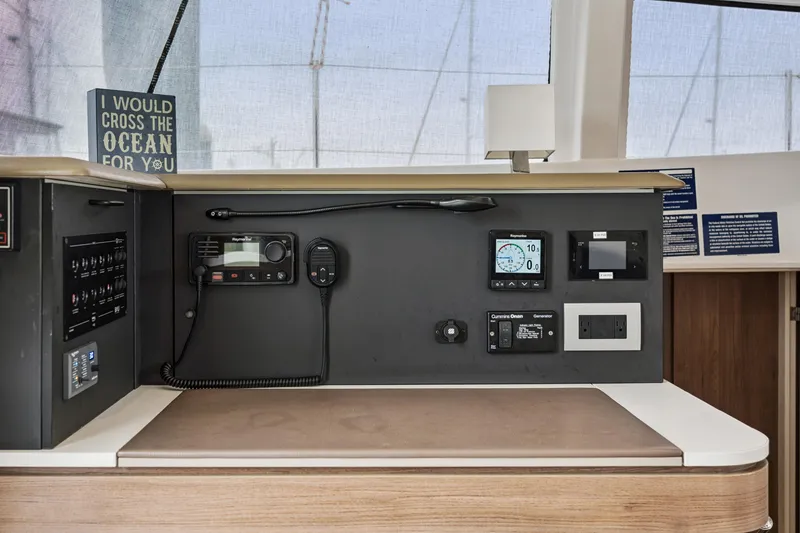Slide: The Image of Control panel of a 2023 Bali 4.2 yacht with navigation and communication equipment. - 82