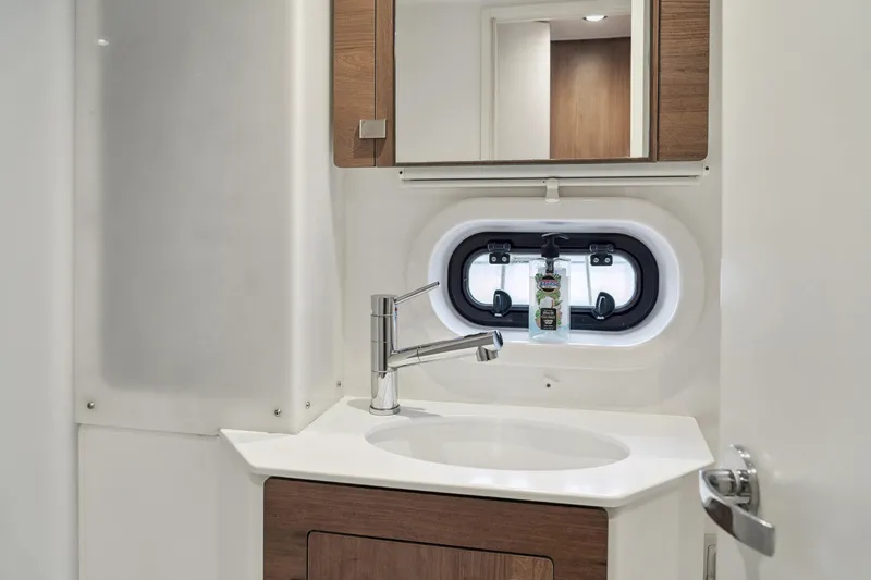 Slide: The Image of Modern bathroom interior in 2023 Bali 4.2 yacht, featuring sleek sink and mirror. - 89