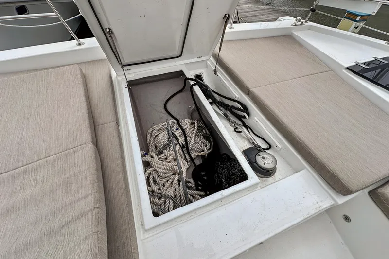 Slide: The Image of Open storage compartment on 2023 Bali 4.2 boat with ropes and equipment. - 97