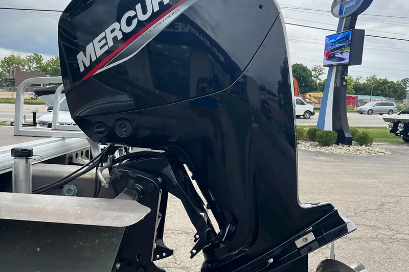 Slide: The Image of 2022 Sun Tracker Party Barge 20 DLX with Mercury outboard motor in parking lot. - 13