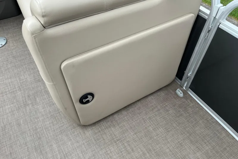 Slide: The Image of 2022 Sun Tracker Party Barge 20 DLX interior seating detail with beige upholstery. - 2