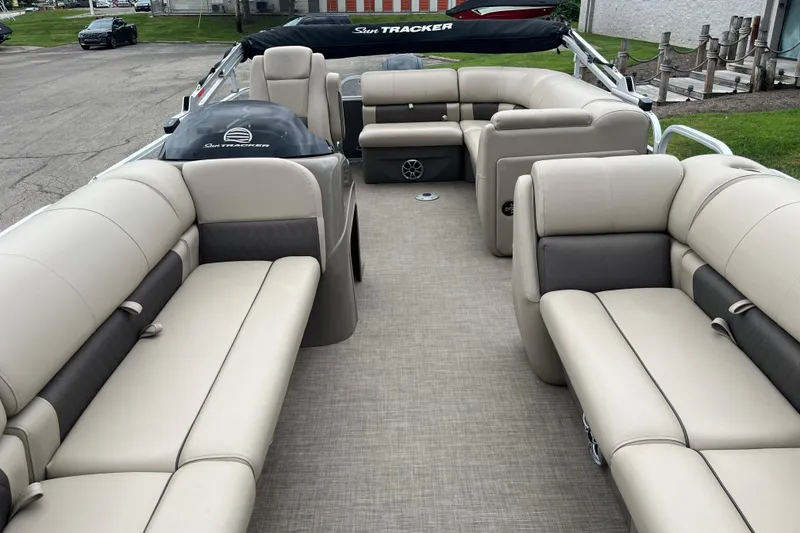 Slide: The Image of 2022 Sun Tracker Party Barge 20 DLX interior with spacious seating and modern design. - 5