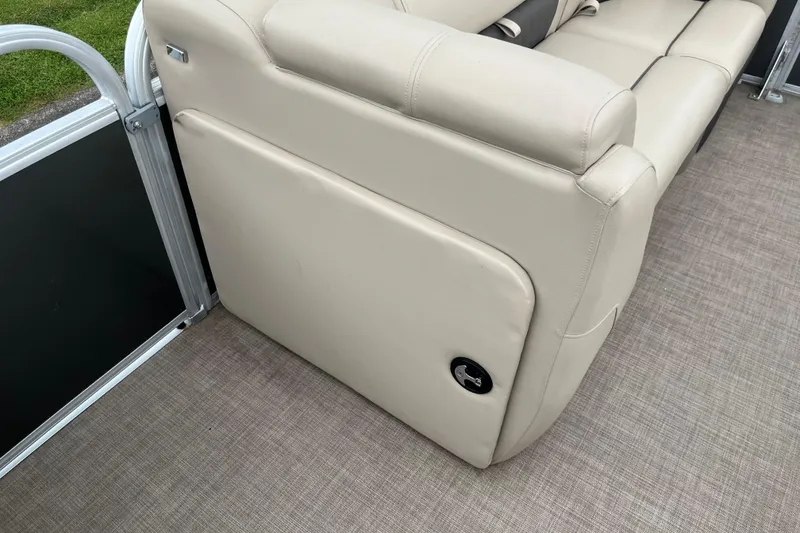 Slide: The Image of 2022 Sun Tracker Party Barge 20 DLX interior with beige seating and flooring. - 7
