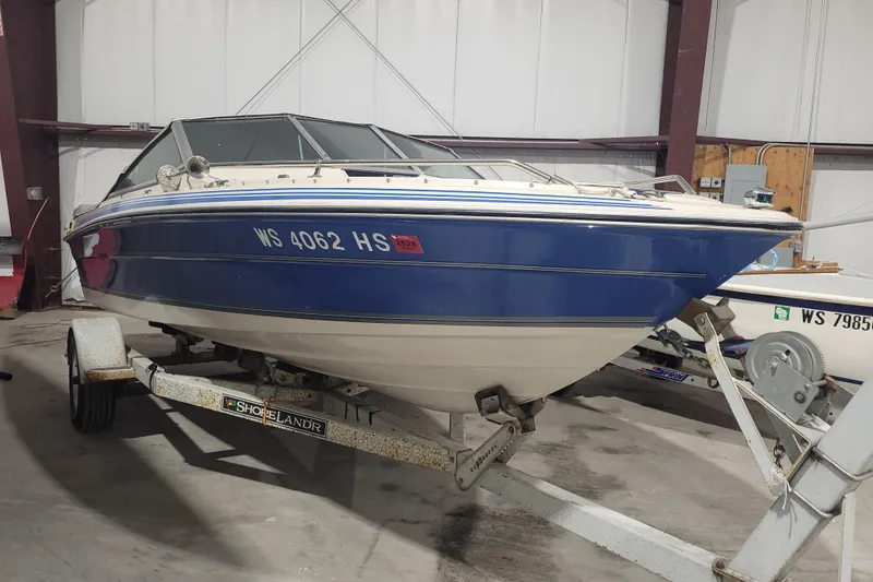 Slide: The Image of 1986 Sea Ray Seville 18 Bowrider on trailer in indoor storage. - 1