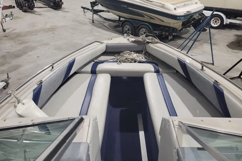 Slide: The Image of 1986 Sea Ray Seville 18 Bowrider interior with blue and white seating. - 3