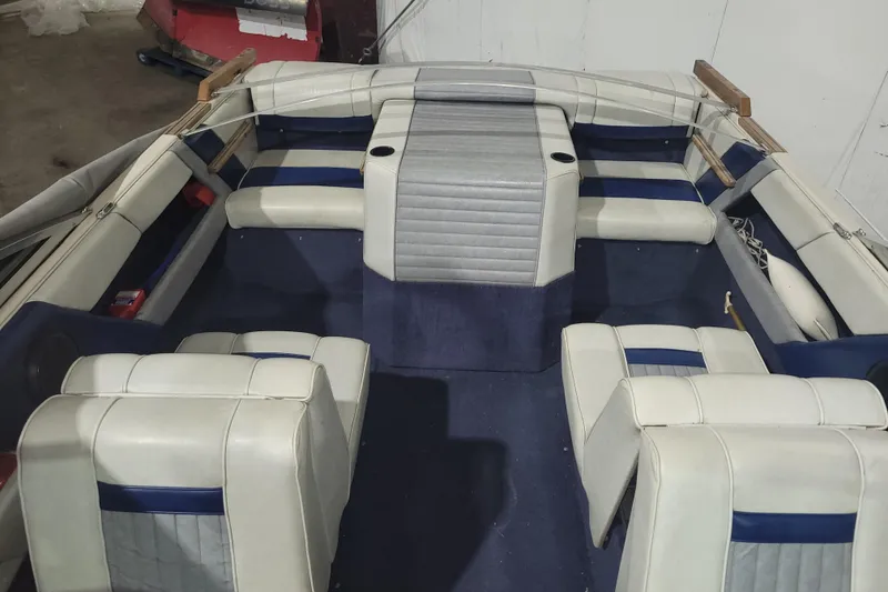Slide: The Image of 1986 Sea Ray Seville 18 Bowrider interior with white and blue seating. - 4
