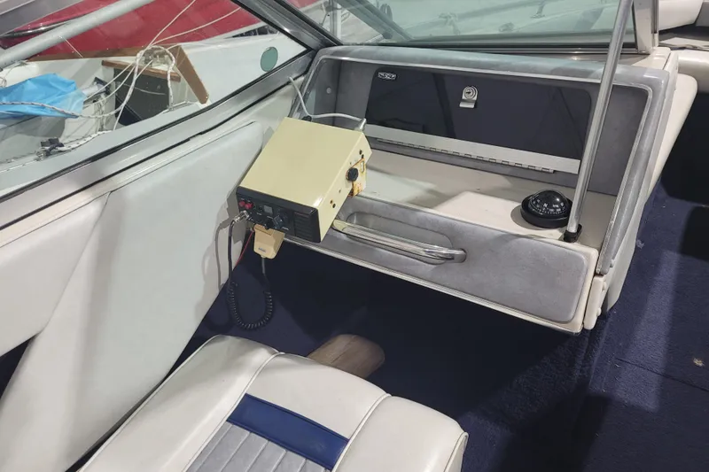 Slide: The Image of 1986 Sea Ray Seville 18 Bowrider interior with vintage radio and compass. - 6