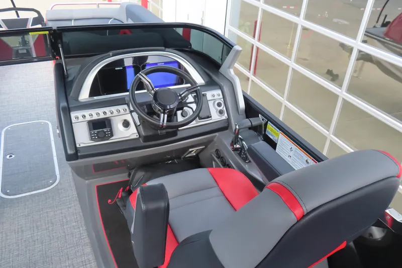 Slide: The Image of 2024 Trifecta 25Sport RF9 DC 3.0 Plus boat cockpit with modern steering and controls. - 10