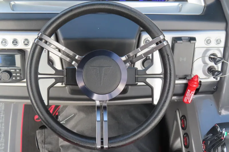 Slide: The Image of Steering wheel of 2024 Trifecta 25Sport RF9 DC 3.0 Plus boat dashboard. - 20
