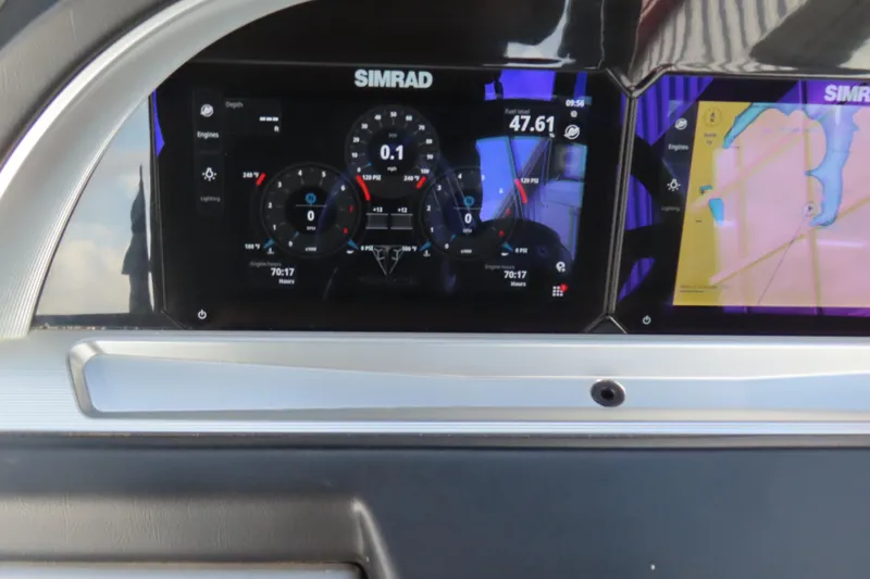 Slide: The Image of Simrad display on 2024 Trifecta 25Sport RF9 DC 3.0 Plus dashboard showing navigation and engine data. - 22