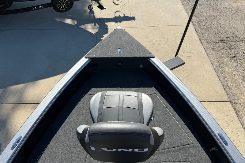 Slide: The Image of 2026 Lund 1875 Pro Guide boat with a sleek, modern design and comfortable seating. - 10