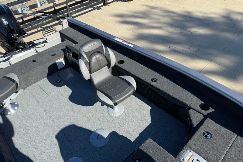 Slide: The Image of 2026 Lund 1875 Pro Guide boat interior with seating and storage compartments. - 18