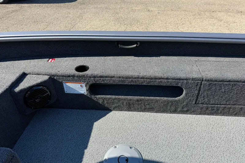 Slide: The Image of 2026 Lund 1875 Pro Guide boat interior with speaker and storage compartment. - 20