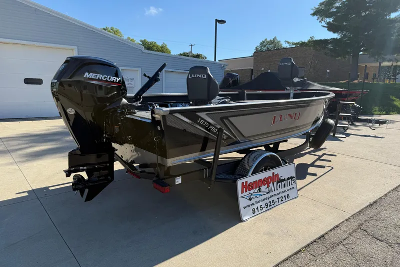 Slide: The Image of 2026 Lund 1875 Pro Guide boat with Mercury engine at Hennepin Marine dealership. - 7