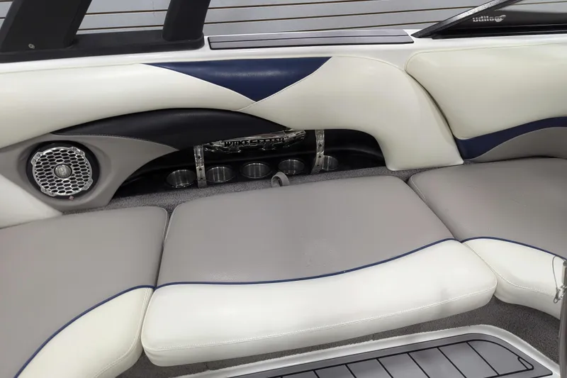 Slide: The Image of 2012 Malibu Wakesetter VLX interior with cushioned seating and built-in speaker system. - 20