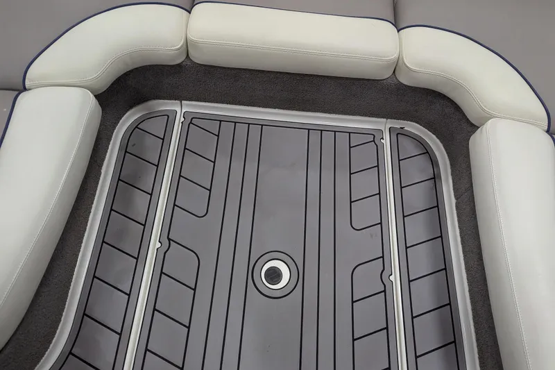 Slide: The Image of 2012 Malibu Wakesetter VLX interior seating with gray and white upholstery. - 21