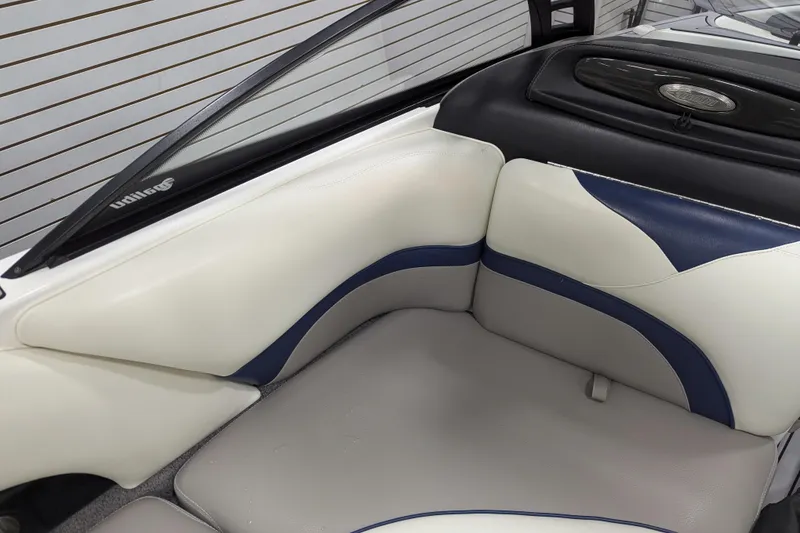 Slide: The Image of 2012 Malibu Wakesetter VLX interior with white and blue leather seating. - 25