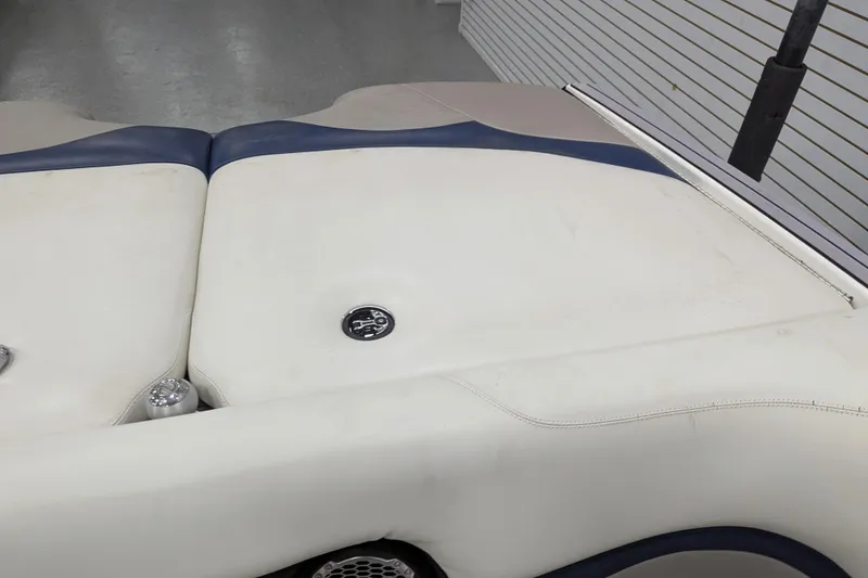 Slide: The Image of 2012 Malibu Wakesetter VLX boat interior with white and blue upholstery. - 27