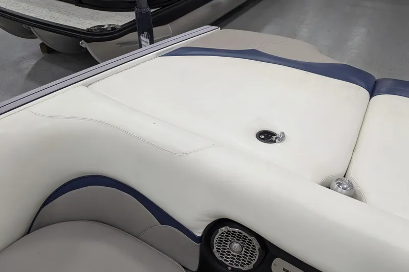 Slide: The Image of 2012 Malibu Wakesetter VLX boat interior with white and blue upholstery. - 28