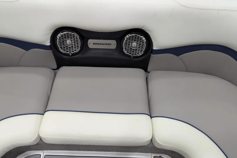 Slide: The Image of 2012 Malibu Wakesetter VLX interior with cushioned seating and integrated speakers. - 29