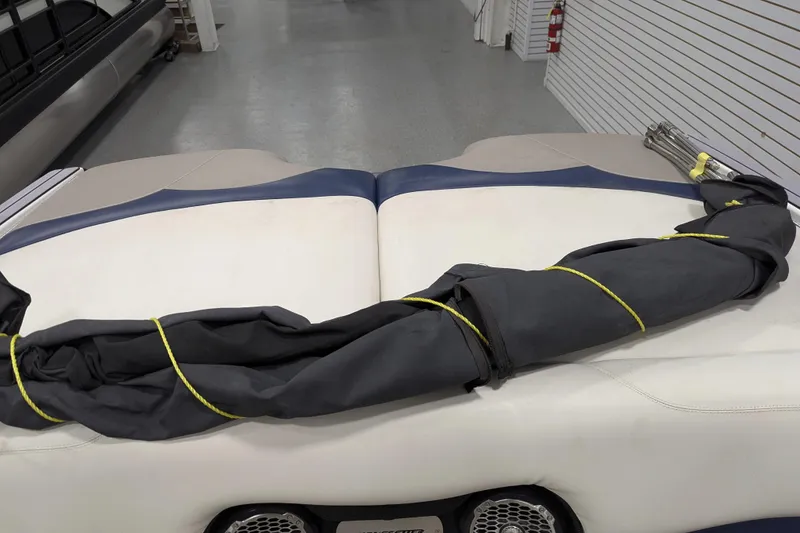 Slide: The Image of 2012 Malibu Wakesetter VLX boat interior with folded cover on seat. - 37