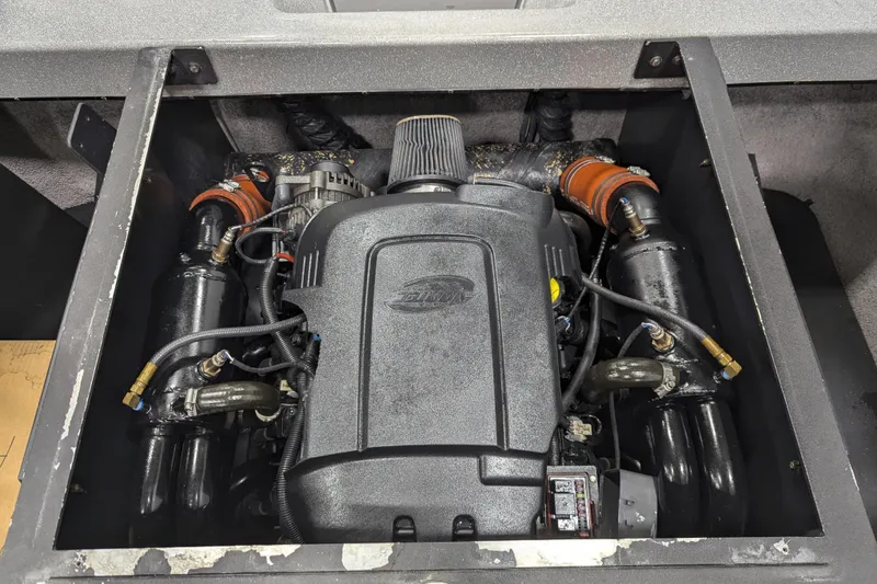 Slide: The Image of 2012 Malibu Wakesetter VLX engine compartment, showcasing detailed components and layout. - 38