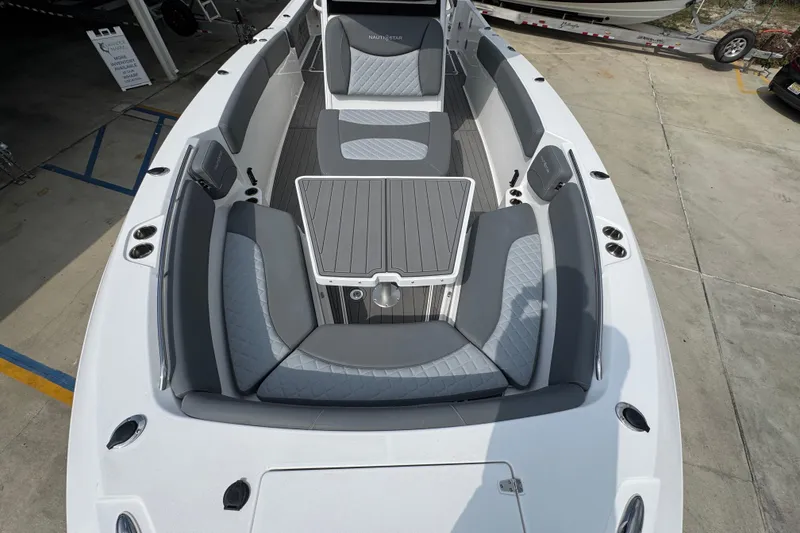 Slide: The Image of 2026 NauticStar 332 Offshore boat with spacious seating and sleek design. - 21