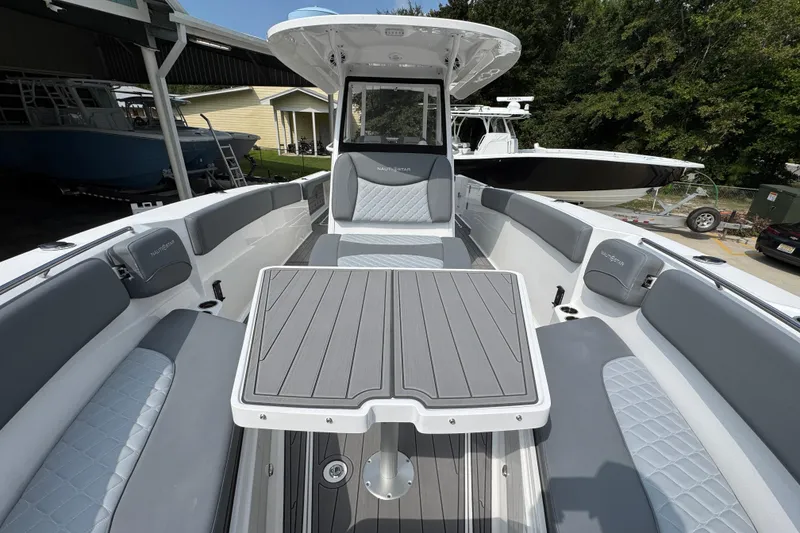 Slide: The Image of 2026 NauticStar 332 Offshore boat interior with sleek seating and modern design. - 23