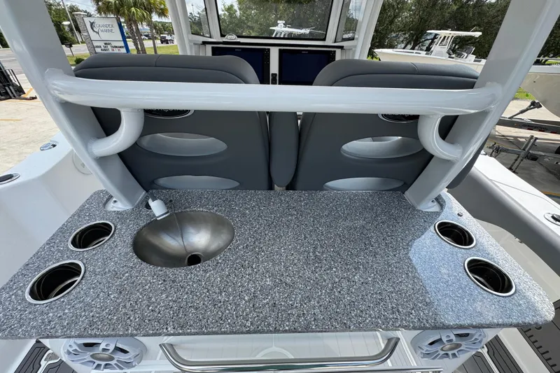 Slide: The Image of 2026 NauticStar 332 Offshore boat interior with granite countertop and stainless steel sink. - 38