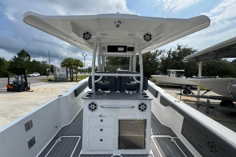 Slide: The Image of 2026 NauticStar 332 Offshore boat interior with modern helm and seating area. - 39