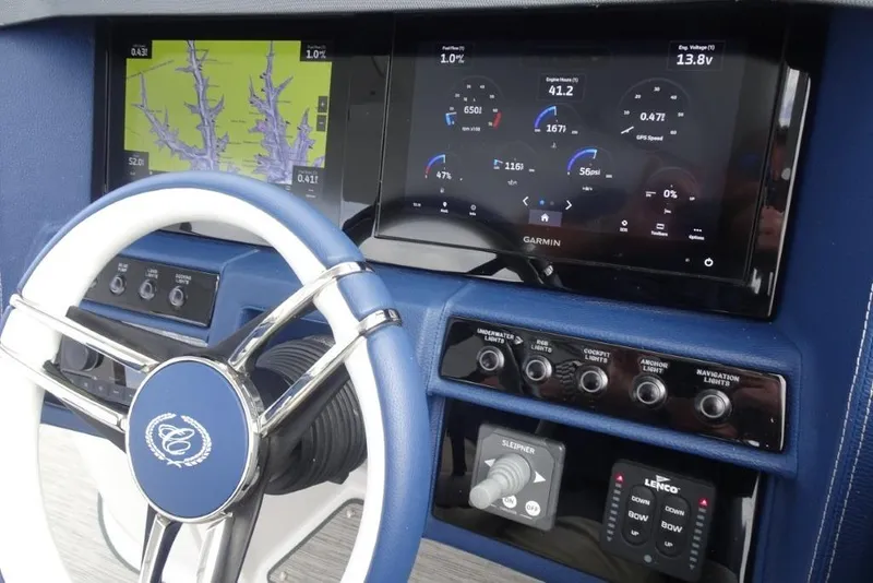 Slide: The Image of 2023 Cobalt A29 boat dashboard with Garmin navigation and control systems. - 19