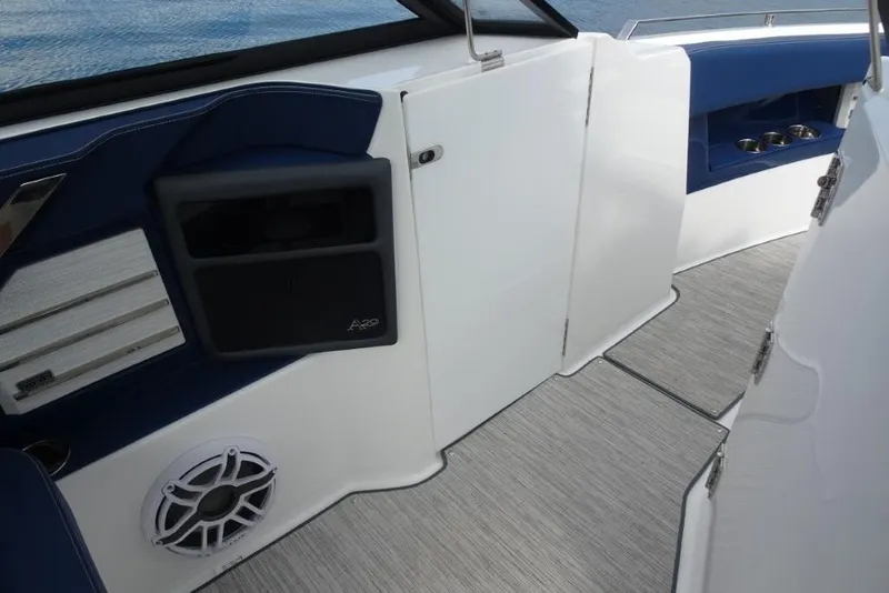 Slide: The Image of 2023 Cobalt A29 boat interior with sleek design, featuring blue and white accents. - 23