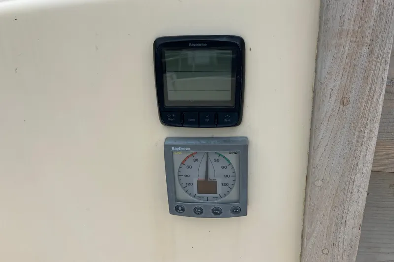 Slide: The Image of Raymarine and Raytheon instruments on 1990 Island Packet 32 Cutter sailboat. - 40