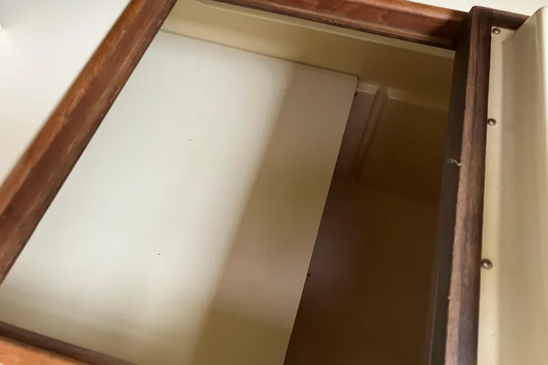 Slide: The Image of Interior storage compartment of 1990 Island Packet 32 Cutter sailboat. - 33