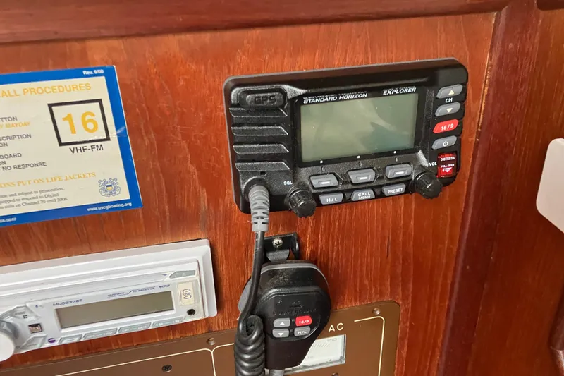 Slide: The Image of VHF radio and control panel on 1990 Island Packet 32 Cutter sailboat. - 35