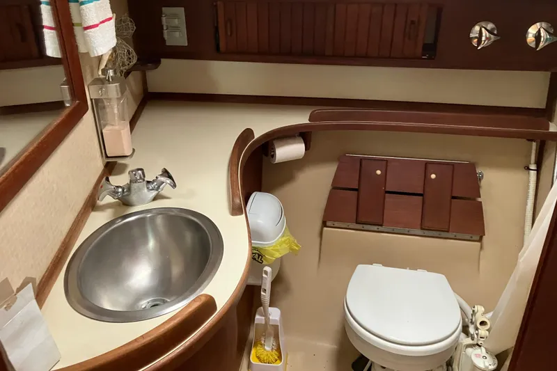 Slide: The Image of Bathroom of 1990 Island Packet 32 Cutter yacht with sink and toilet. - 39