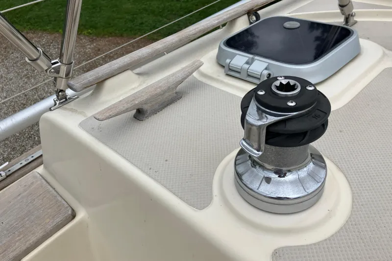 Slide: The Image of Deck of 1990 Island Packet 32 Cutter with winch and hatch. - 46