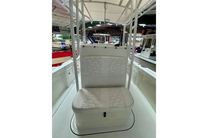 Slide: The Image of 2026 Parker 21SE Center Console boat interior with cushioned seating. - 10