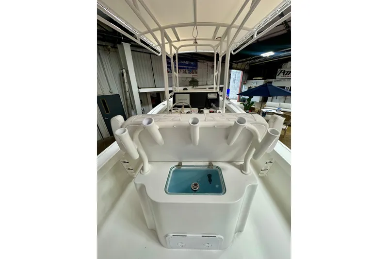 Slide: The Image of 2026 Parker 21SE Center Console boat interior with rod holders and livewell. - 5