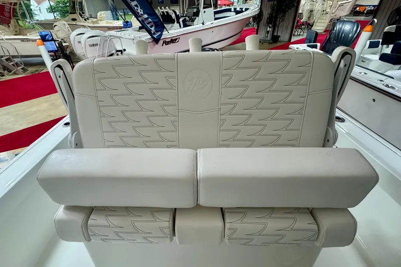 Slide: The Image of 2026 Parker 21SE Center Console boat seat with stylish stitching and armrests. - 7