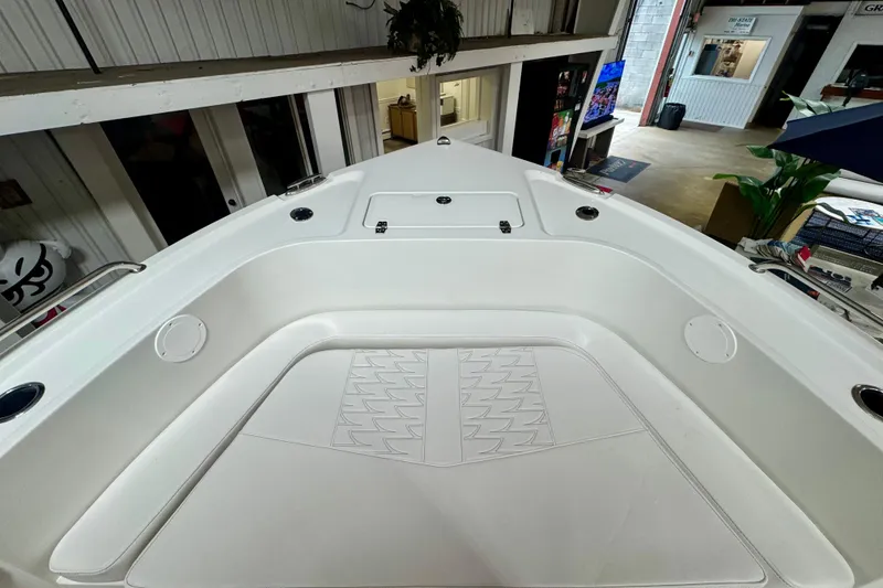 Slide: The Image of 2026 Parker 21SE Center Console boat interior, showcasing spacious seating and storage compartments. - 9